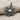 Twisted Rope Sun Pendant, oxidized silver, angled close-up view on fabric