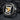Detailed angled view of oxidized silver military eagle ring with Airborne banner resting on dark textured stone.