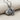 Fantail Goldfish Pendant, oxidized silver, side angle product photo on fabric