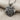 Twin Lion Pendant, oxidized silver, angled perspective view on fabric