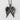 Arched Angel Wings Pendant, black rhodium plated, front view on textured white surface