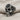 Gothic Rosette Skull Ring, oxidized silver, three-quarter view on linen