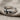 Double Knot Ring, angled three-quarter view on woven textured cloth