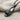 Slide Sandal Pendant, black rhodium plated, angled view on neutral fabric