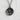 Sakura blossom medallion pendant, black rhodium finish, front view on white textured surface