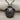 Gliding Sea Turtle Pendant, black rhodium, product photo on fabric
