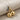 Twin Cherry Pendant, two-tone, angled view on fabric