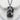 Maneki Neko Pendant, black rhodium, front view on stone surface