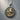 Detailed view of Saint George pendant in 925 sterling silver resting on wood, highlighting the intricate scrollwork