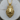 Close-up of the handcrafted royal crowned lion pendant resting on a wooden log displaying premium jewelry craftsmanship