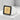 Close-up of the two-tone Japanese dream kanji ring resting on a textured stone block highlighting its details