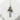 Angled view of the oxidized silver Osaka takoyaki pendant resting on a textured white stone surface showing engraved text