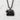 Hokkaido Bear Pendant, black rhodium, front view on textured wall