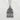 Close-up of the architectural sterling silver Himeji castle pendant resting on a textured light stone background.