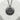 Japanese Onsen Medallion Pendant, black rhodium, product display on stone