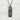 Kizuna Kanji Pendant, black rhodium plated, front view on stone surface