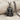 Kybele Enthroned Goddess Pendant, black rhodium plated, front view on fabric
