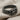 Gordian Knot Ring, black rhodium, angled view on fabric