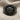 Lydian Lion Coin Ring, black rhodium finish, front view on fabric