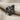Hittite Double Headed Eagle Earring, black rhodium, front view on fabric