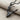 Ballet Dancer Pendant, black rhodium, angled product photo on fabric