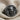 Jester Skull Ring, black rhodium plated, angled product view on fabric