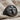 Crucifix Signet Ring, black rhodium plated, product photo on linen fabric