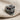 Lobotomy Skull Ring, oxidized silver, angled front view on textured fabric