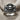 Pirate Crossbones Skull Ring, oxidized, angled macro view on textile fabric