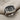 Star of Bethlehem Nativity Ring in oxidized silver, detailed top angle on fabric