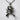 Crossed Pistols Pirate Skull Pendant, oxidized silver, front view on texture