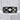 Geometric Cutout Ring, black rhodium plated, front view on concrete block