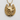 Detailed equestrian gold horseshoe pendant with intricate horse mane engraving shown on textured wall