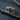 Sapphire Crater Ring, oxidized silver, angled front view on textured surface