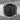 Masonic G Square Compass Ring in black rhodium, front view on rock surface