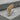 Acacia Sprig Lapel Pin, two-tone finish, angled view on stone
