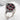 Persephone Pomegranate Ring, oxidized silver, three-quarter angled view on stone