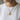 Model wearing the gold feathered serpent medallion pendant on a delicate chain necklace with a white t-shirt