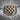 Croatian Checkerboard Ring, two-tone finish, front view on stone