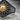 Sun Archer Ring, oxidized, close-up of sculpted sun emblem