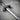 Detailed view of the blade on the handcrafted silver sword pendant highlighting the engraved Latin motto