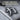 Strength Kanji Tag Pendant, oxidized, close-up of raised kanji character