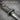 Mokume Katana Sword Pendant, oxidized, close-up of wood-grain grip and guard