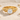 Skull Engagement Ring, gold vermeil, front view on sand