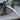 Reaper Scythe Pendant, oxidized, close-up of blade and handle details