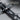 Military cross pendant, oxidized silver, close-up of combat boots and dog tags