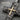 Layered Cross Pendant, oxidized, angled close-up of textured surface