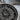 Close up macro view of central deity face on handcrafted sterling silver Aztec calendar pendant