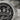 Top down close up of silver Templar ring displaying crown and cross motif with detailed engraving and text inscription