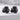 Sleeping Baby Dragon Earring, black rhodium plated, pair displayed on stone surface